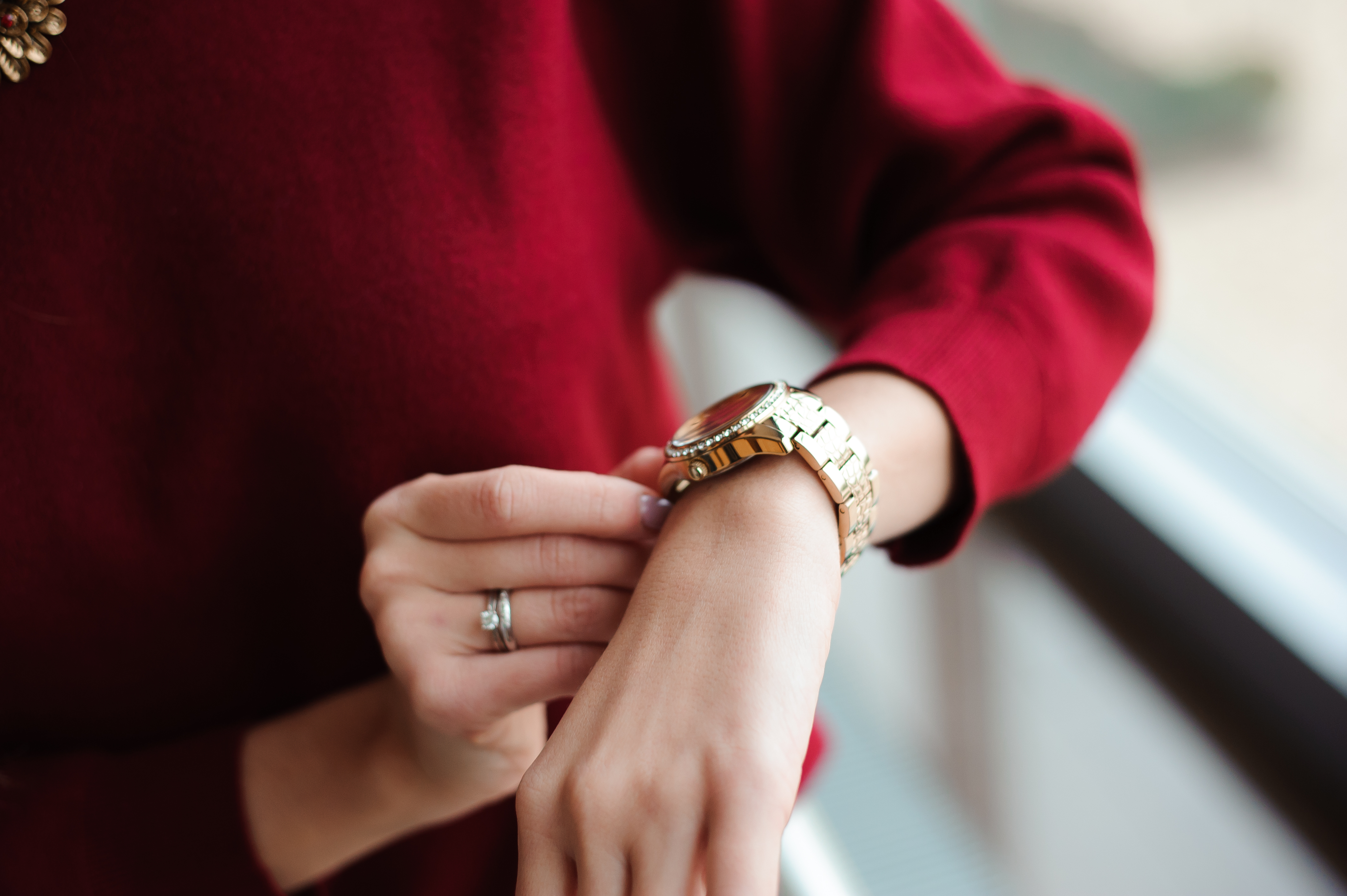 A woman with a watch checking the time | Source: Shutterstock