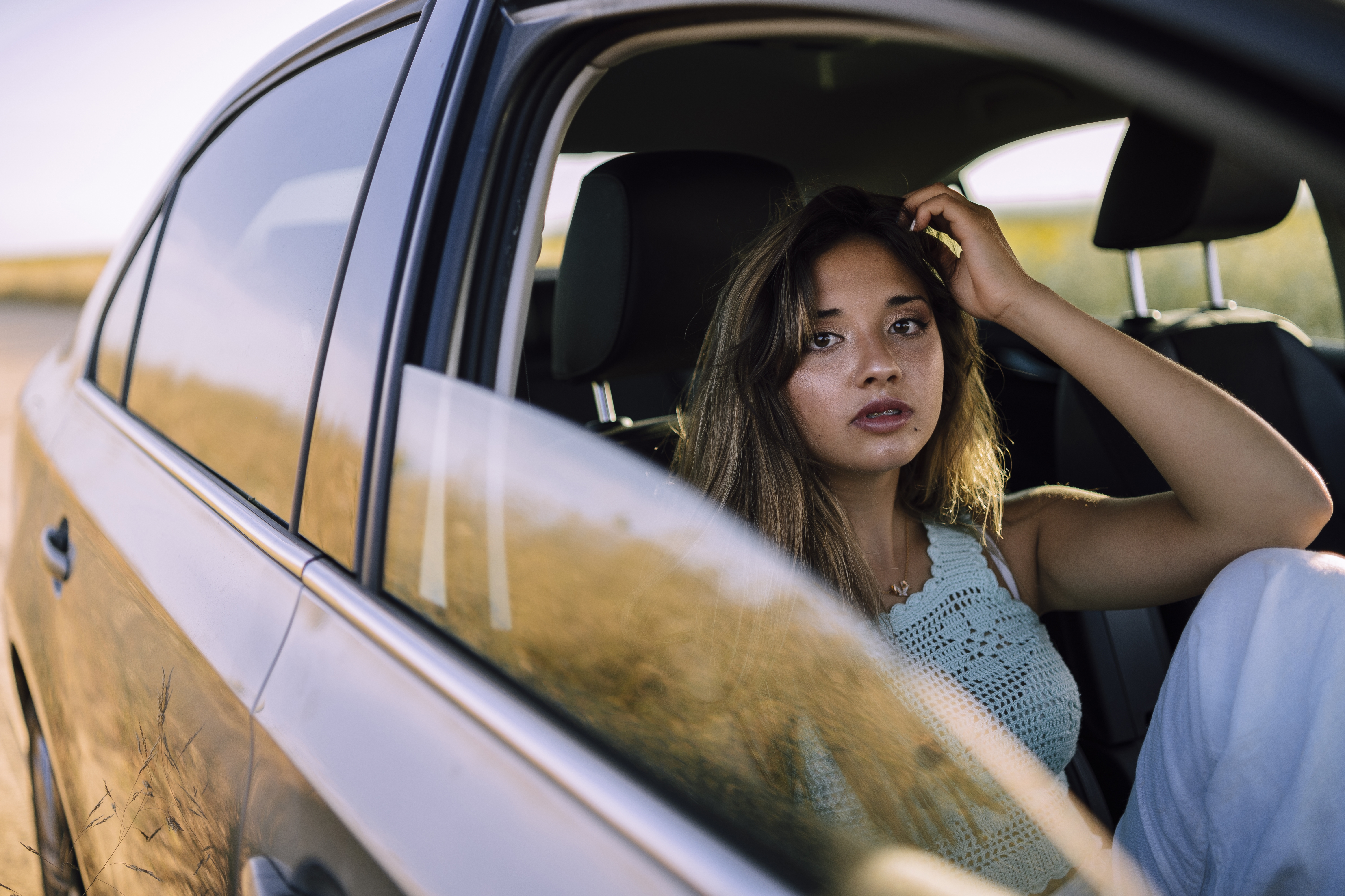 Silent woman on passenger seat | Source: Freepik