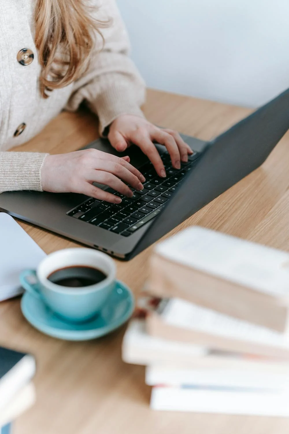 A closeup of a young woman using her laptop | Source: Pexels