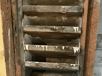 In-wall, wooden vent-like object between wall studs in ~100 year old house, but not open to the air outside! Any idea?